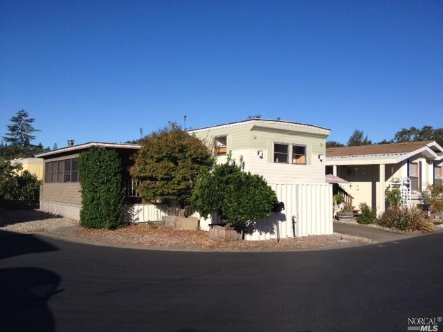 a view of a house with a street