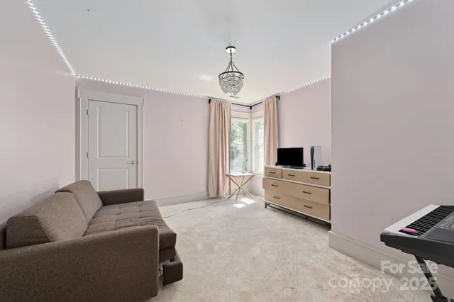 a bathroom with a sink vanity and shower
