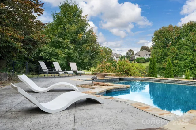 a kitchen with stainless steel appliances a microwave a stove and a refrigerator