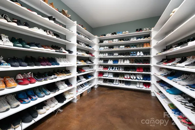 a bathroom with a shower sink vanity mirror and toilet