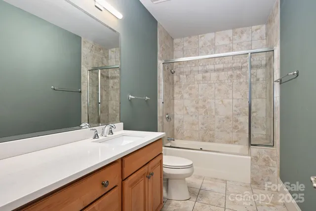 a aerial view of a house with a yard basket ball court and outdoor seating
