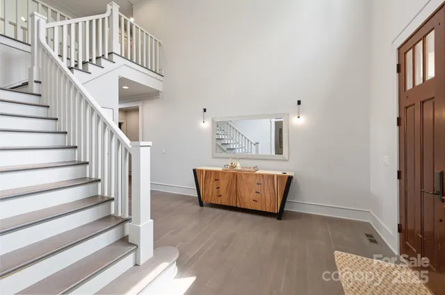 a view of staircase with wooden floor and stairs
