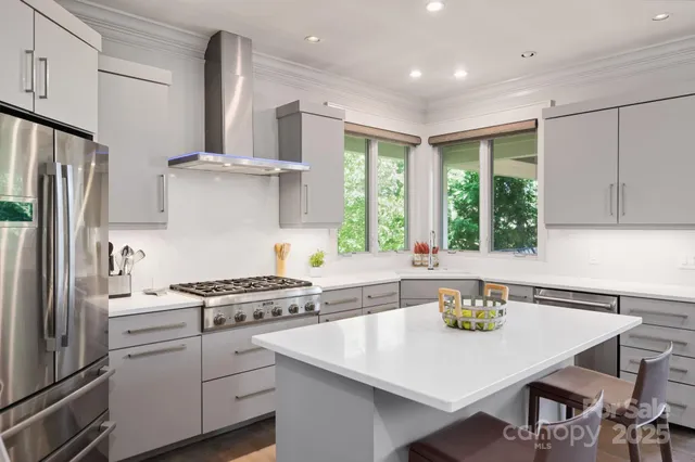 a kitchen with appliances cabinets and a window
