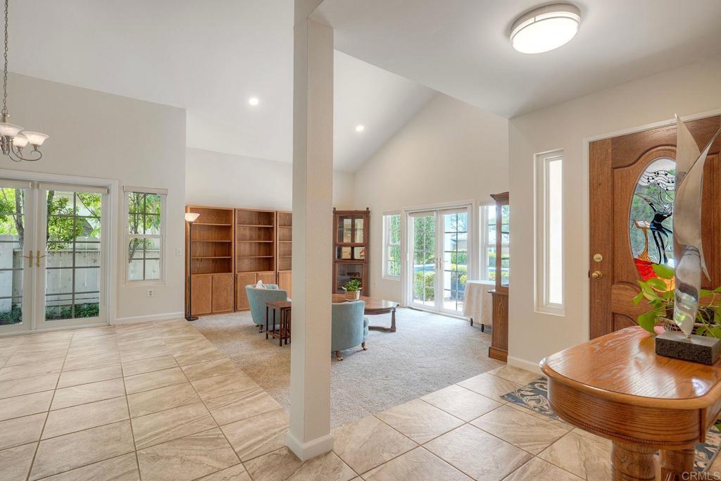 13639 Freeport Road San Diego, CA 92129 - Photo 4 of 44 a living room with furniture and large windows