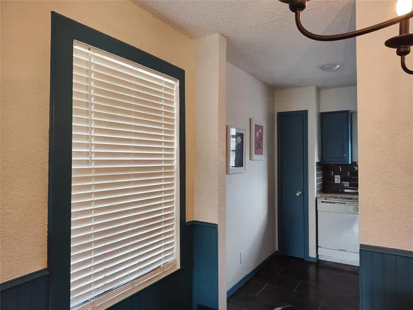 a kitchen with granite countertop cabinets stainless steel appliances and a sink