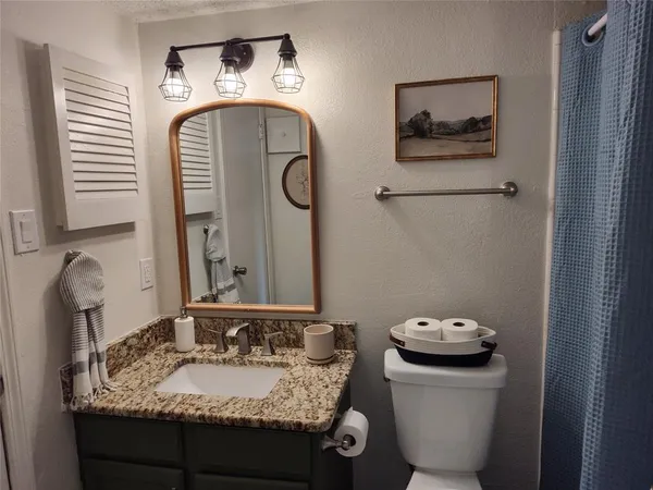 a view of a porch with furniture and a yard