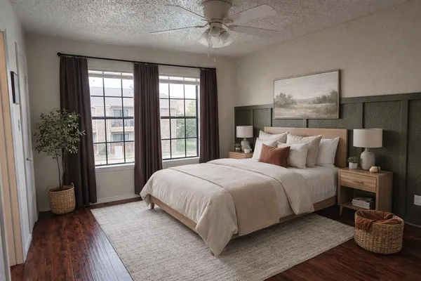 a bedroom with a large bed and a window