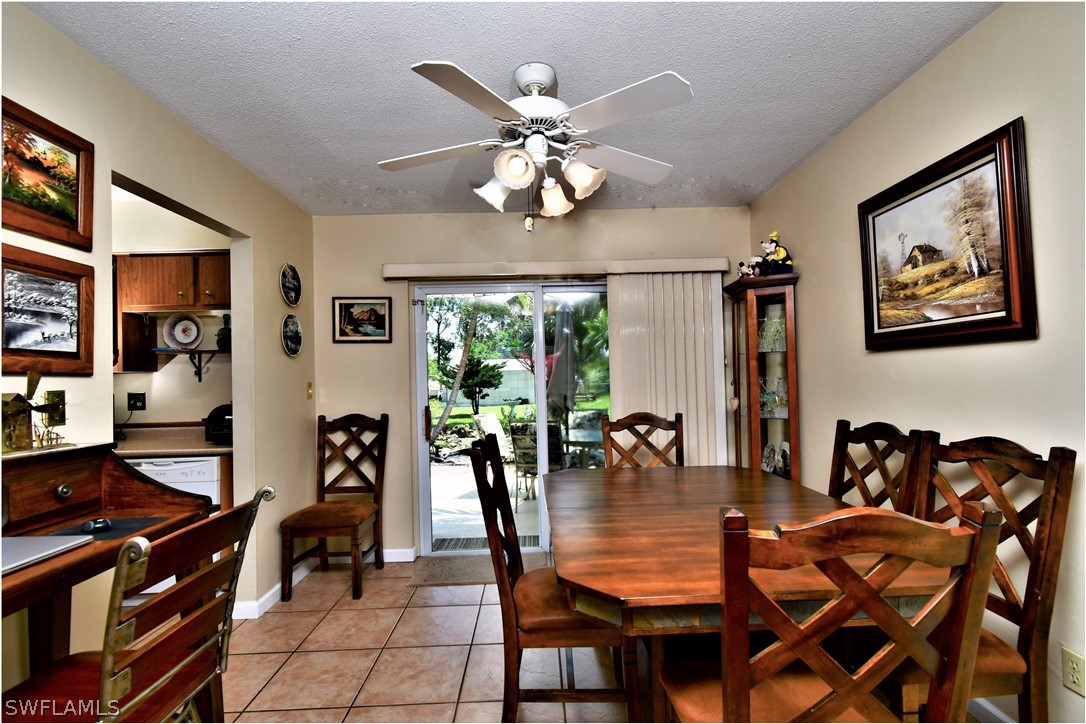 12 Massachusetts Road Lehigh Acres, FL 33936 - Photo 11 of 30 a dining room with furniture and window