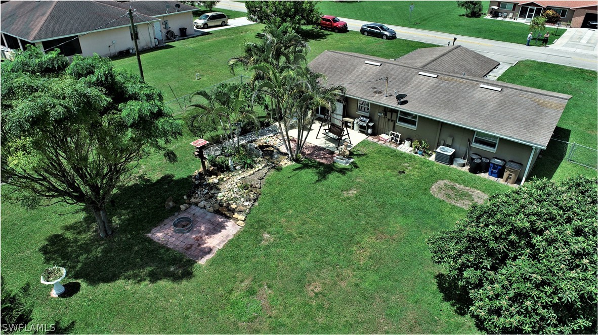 12 Massachusetts Road Lehigh Acres, FL 33936 - Photo 23 of 30 an aerial view of residential houses with outdoor space and street view