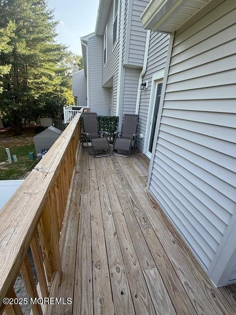 52 Renee Court Jackson, NJ 08527 - Photo 20 of 24 a balcony with wooden floor and lake view