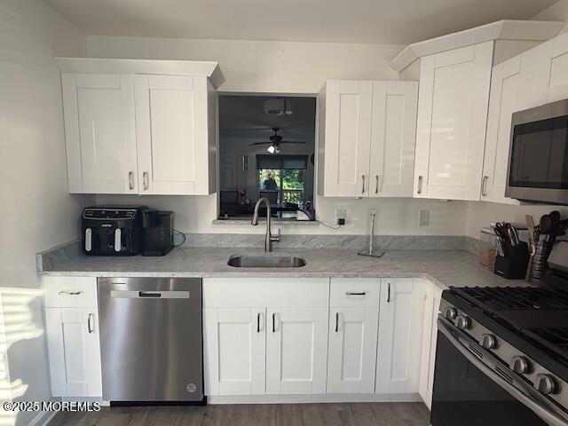 52 Renee Court Jackson, NJ 08527 - Photo 2 of 24 a kitchen with stainless steel appliances granite countertop a stove a sink and a microwave