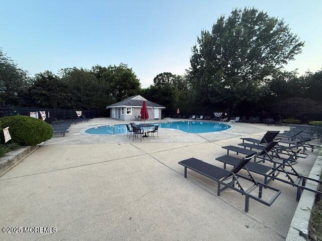 52 Renee Court Jackson, NJ 08527 - Photo 24 of 24 a wooden bench sitting in the middle of a park