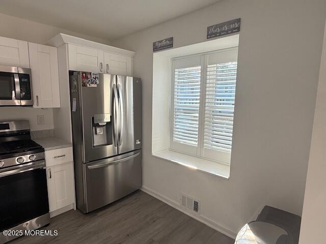 52 Renee Court Jackson, NJ 08527 - Photo 4 of 24 a kitchen with granite countertop stainless steel appliances a refrigerator a stove a sink and a window