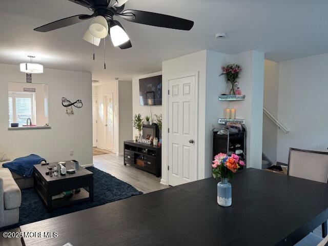 52 Renee Court Jackson, NJ 08527 - Photo 6 of 24 a dining room with wooden floor and a chandelier