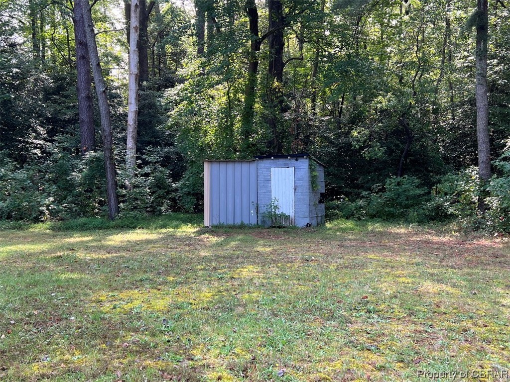 2596 Regent Road Topping, VA 23169 - Photo 7 of 8 View of yard featuring a shed