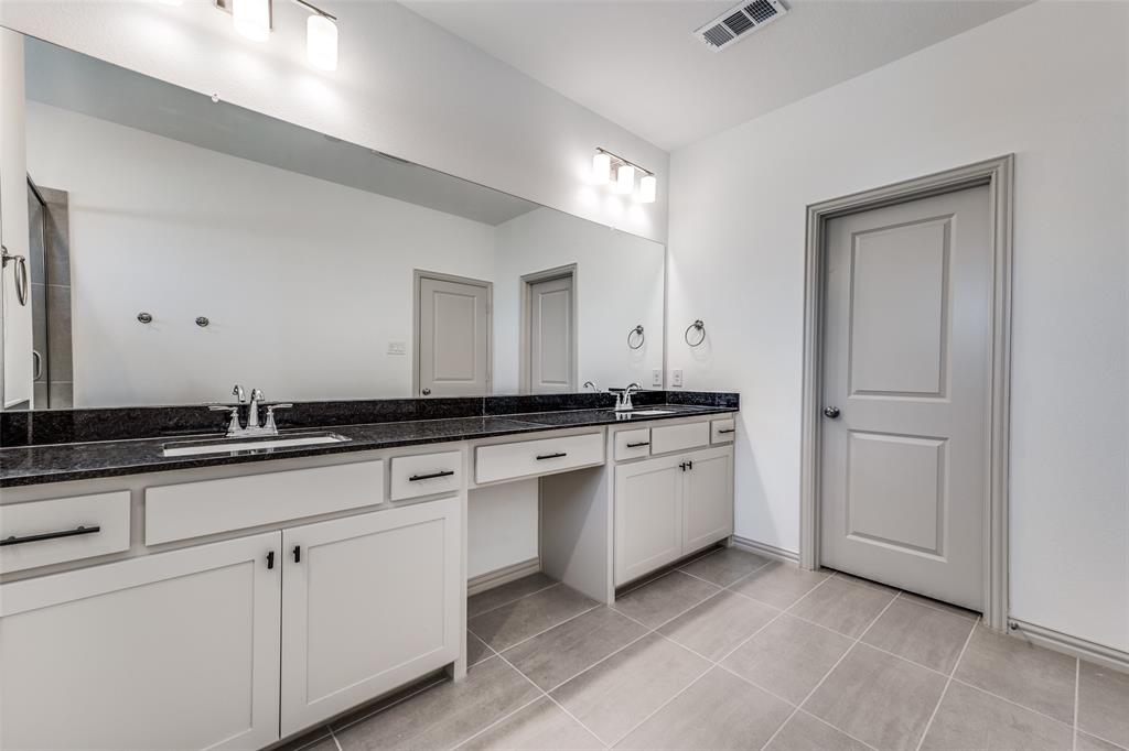 15866 Yellow Elder Road Frisco, TX 75035 - Photo 25 of 25 a large white kitchen with granite countertop white cabinets and a sink