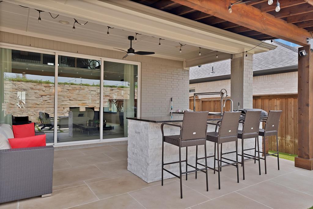1010 Adair Road Prosper, TX 75078 - Photo 27 of 39 a view of a dining room with furniture and chandelier