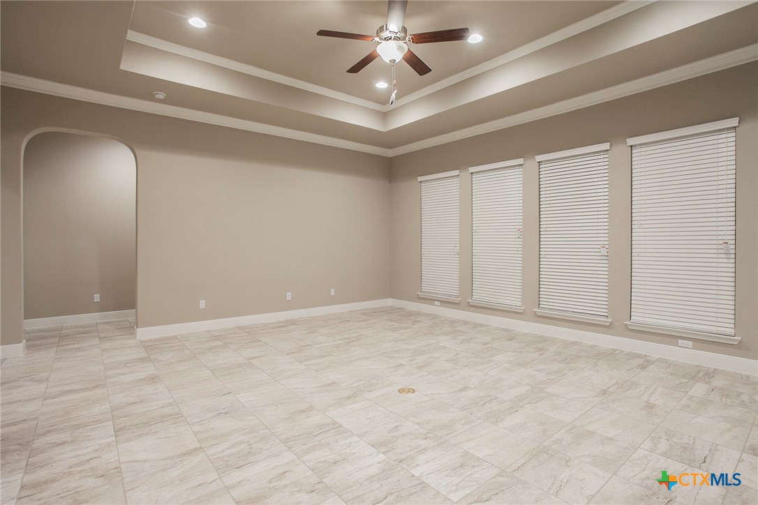 549 Wills Point Way Belton, TX 76513 - Photo 8 of 31 wooden floor in an empty room with a ceiling fan