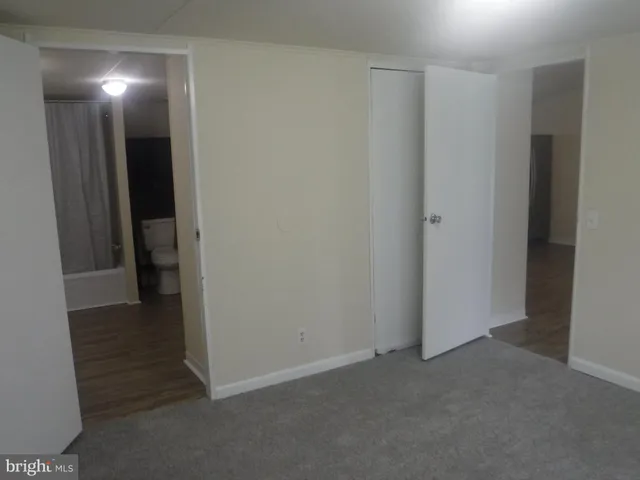 a view of hallway with closet area