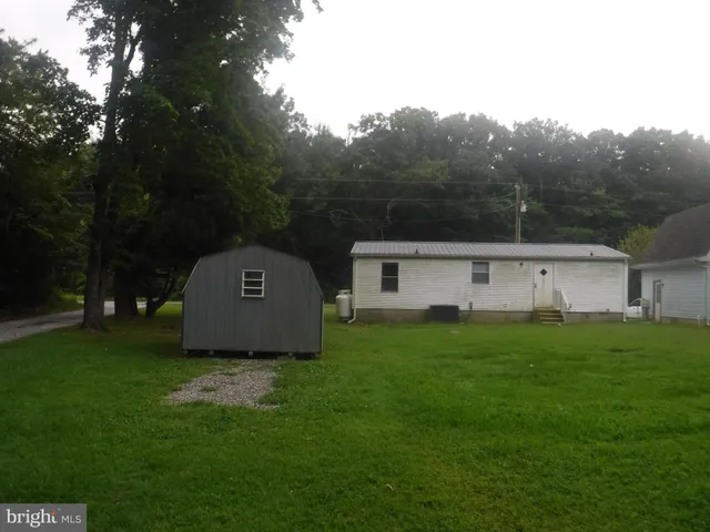 a view of a house with a big yard