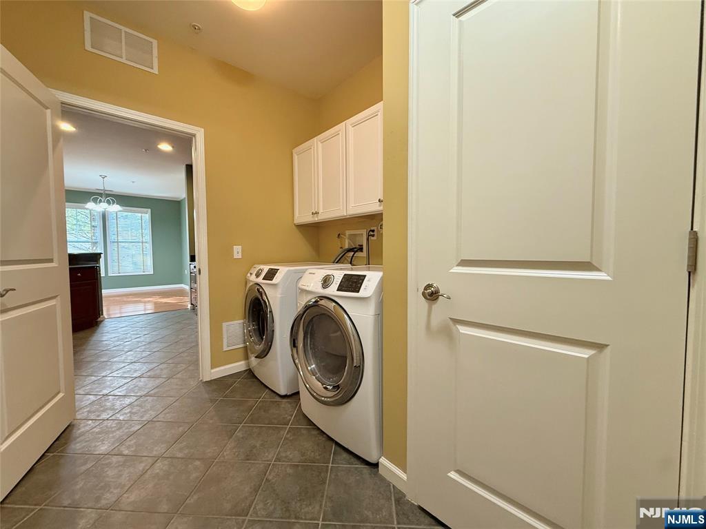 401 River Place Butler, NJ 07405 - Photo 20 of 42 a view of a hallway with washer and dryer