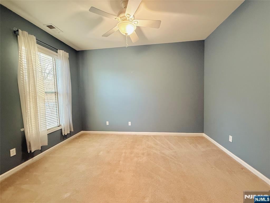 401 River Place Butler, NJ 07405 - Photo 31 of 42 a view of an empty room with a window