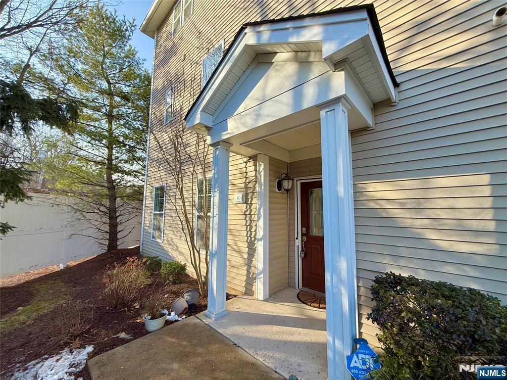 401 River Place Butler, NJ 07405 - Photo 37 of 42 a view of a house with a small yard