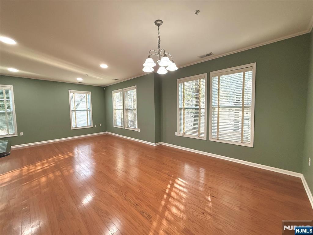 401 River Place Butler, NJ 07405 - Photo 10 of 42 a view of an empty room with window and chandelier