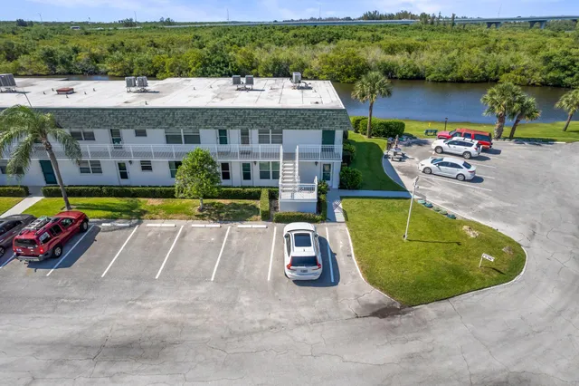 an aerial view of a house with a swimming pool