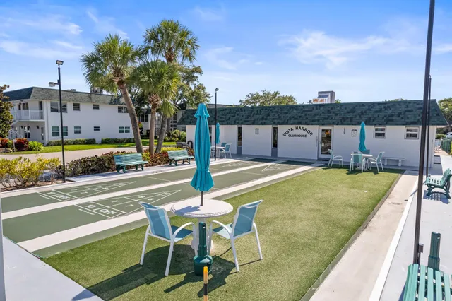 a swimming pool with some trees in the background