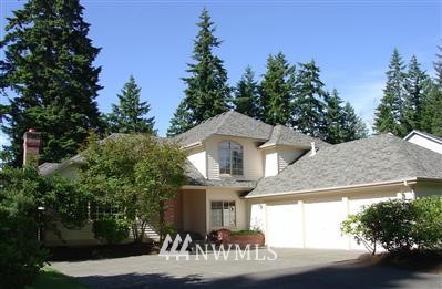 16015 Southeast 149th Street Renton, WA 98059 - Photo 1 of 1 a front view of a house with a garden