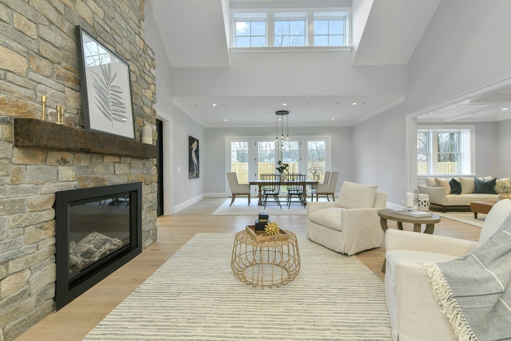 66 Jerusalem Road Cohasset, MA 02025 - Photo 11 of 40 a living room with furniture a fireplace and a large window