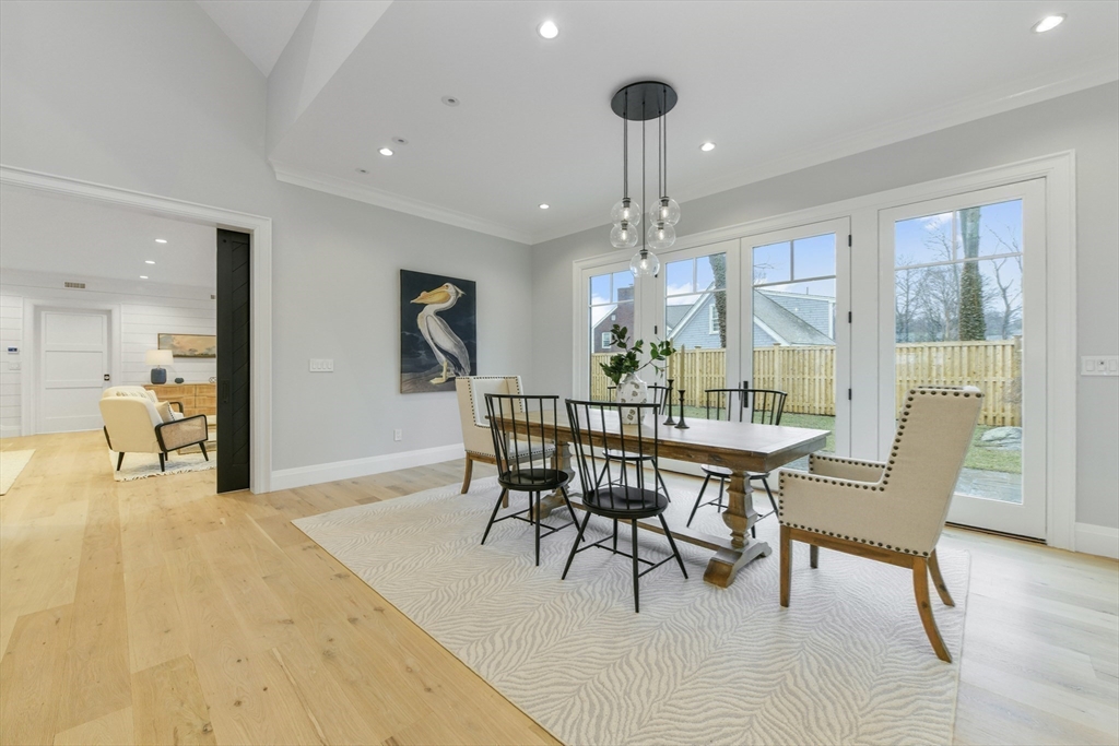 66 Jerusalem Road Cohasset, MA 02025 - Photo 14 of 40 a view of a dining room with furniture and wooden floor