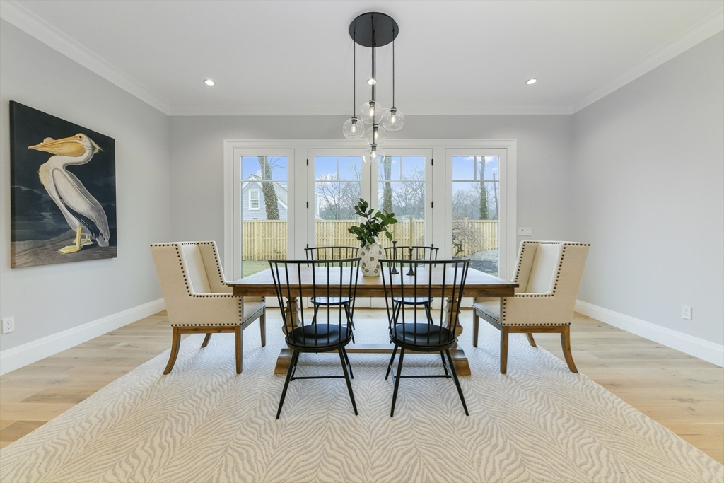 66 Jerusalem Road Cohasset, MA 02025 - Photo 15 of 40 a dining room with furniture a chandelier and window