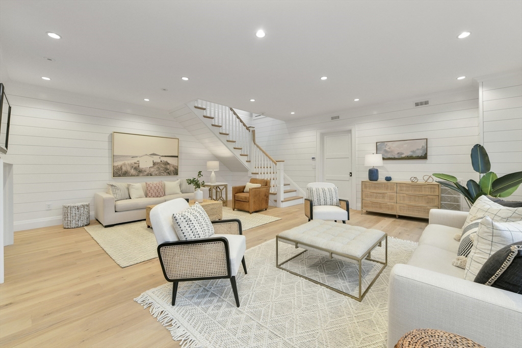 66 Jerusalem Road Cohasset, MA 02025 - Photo 17 of 40 a living room with furniture and a lamp