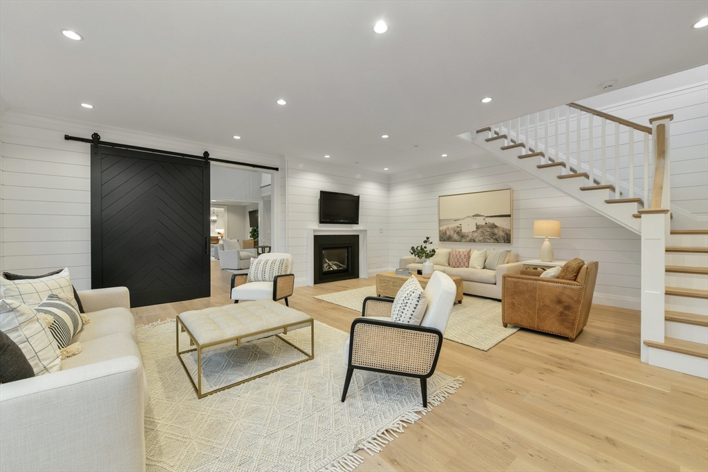 66 Jerusalem Road Cohasset, MA 02025 - Photo 18 of 40 a living room with furniture and a fireplace