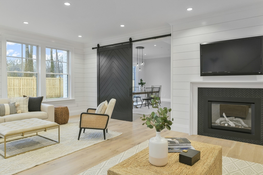 66 Jerusalem Road Cohasset, MA 02025 - Photo 19 of 40 a living room with furniture fireplace and flat screen tv