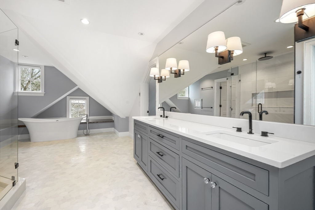 66 Jerusalem Road Cohasset, MA 02025 - Photo 26 of 40 a spacious bathroom with a double vanity sink and a mirror