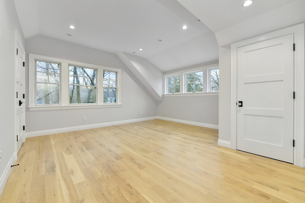 66 Jerusalem Road Cohasset, MA 02025 - Photo 28 of 40 a view of empty room with wooden floor and fan