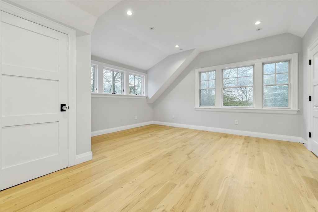 66 Jerusalem Road Cohasset, MA 02025 - Photo 29 of 40 an empty room with wooden floor and windows