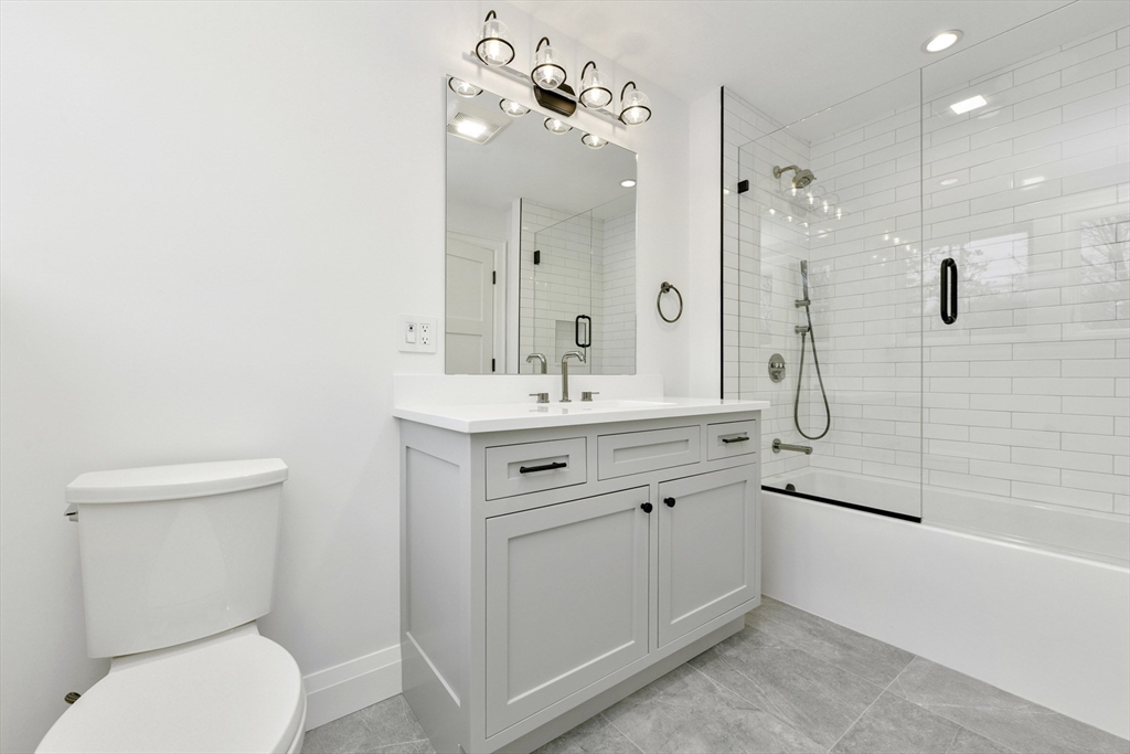 66 Jerusalem Road Cohasset, MA 02025 - Photo 32 of 40 a bathroom with a sink a toilet and shower