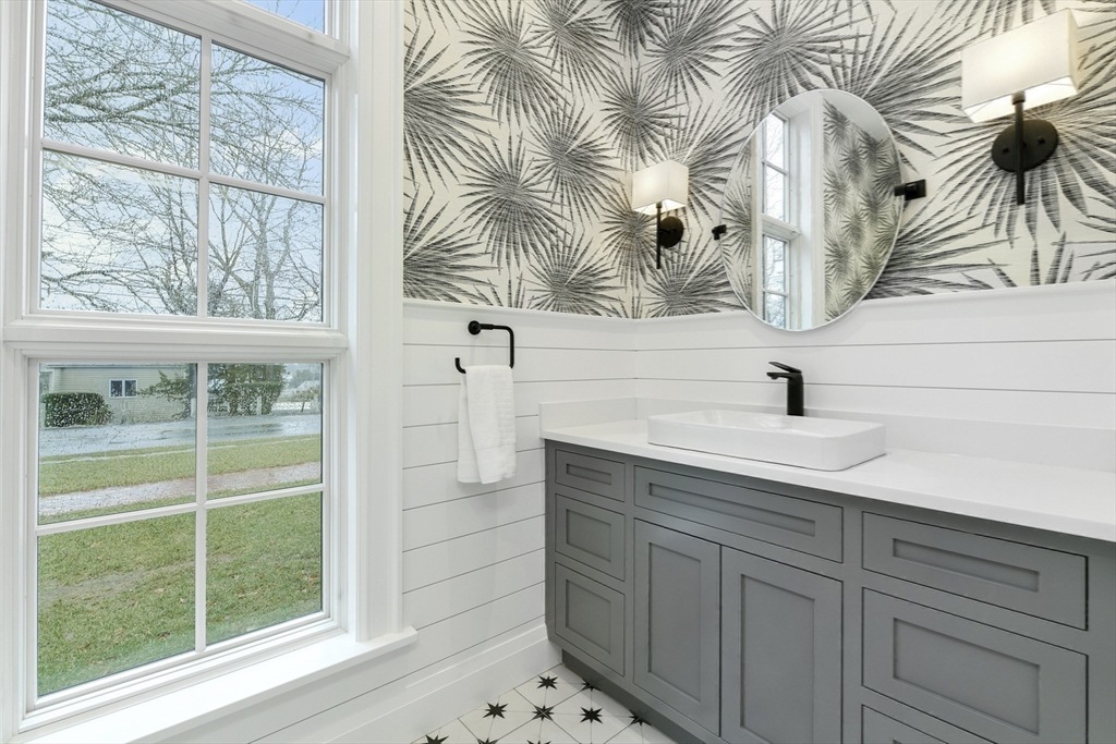 66 Jerusalem Road Cohasset, MA 02025 - Photo 33 of 40 a bathroom with a sink and a mirror