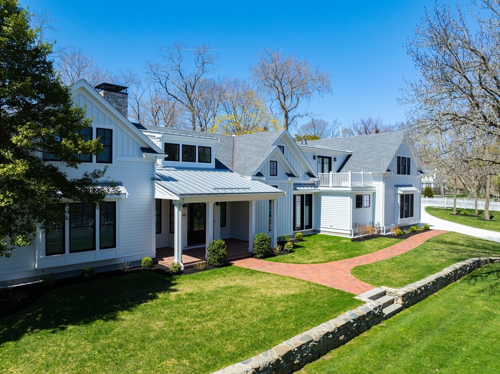 66 Jerusalem Road Cohasset, MA 02025 - Photo 35 of 40 a front view of a house with a yard