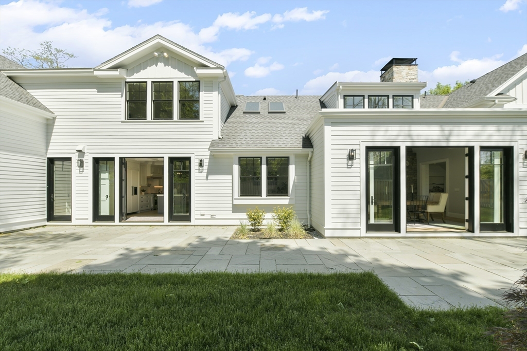 66 Jerusalem Road Cohasset, MA 02025 - Photo 39 of 40 a front view of a house with a yard