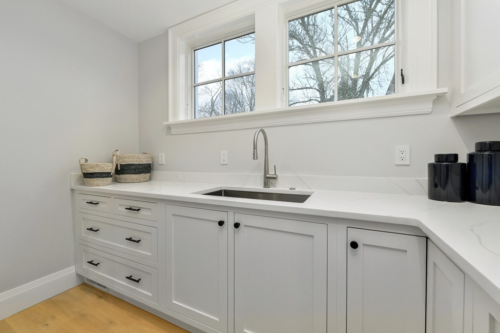 66 Jerusalem Road Cohasset, MA 02025 - Photo 7 of 40 a kitchen with cabinets appliances and a window