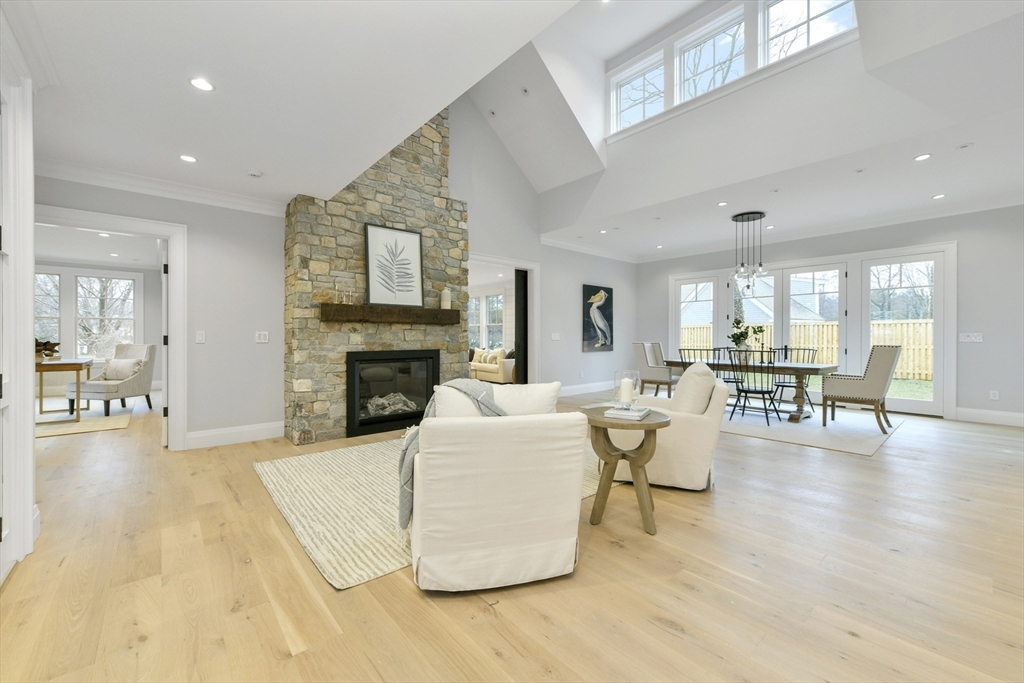 66 Jerusalem Road Cohasset, MA 02025 - Photo 10 of 40 a living room with furniture and a fireplace