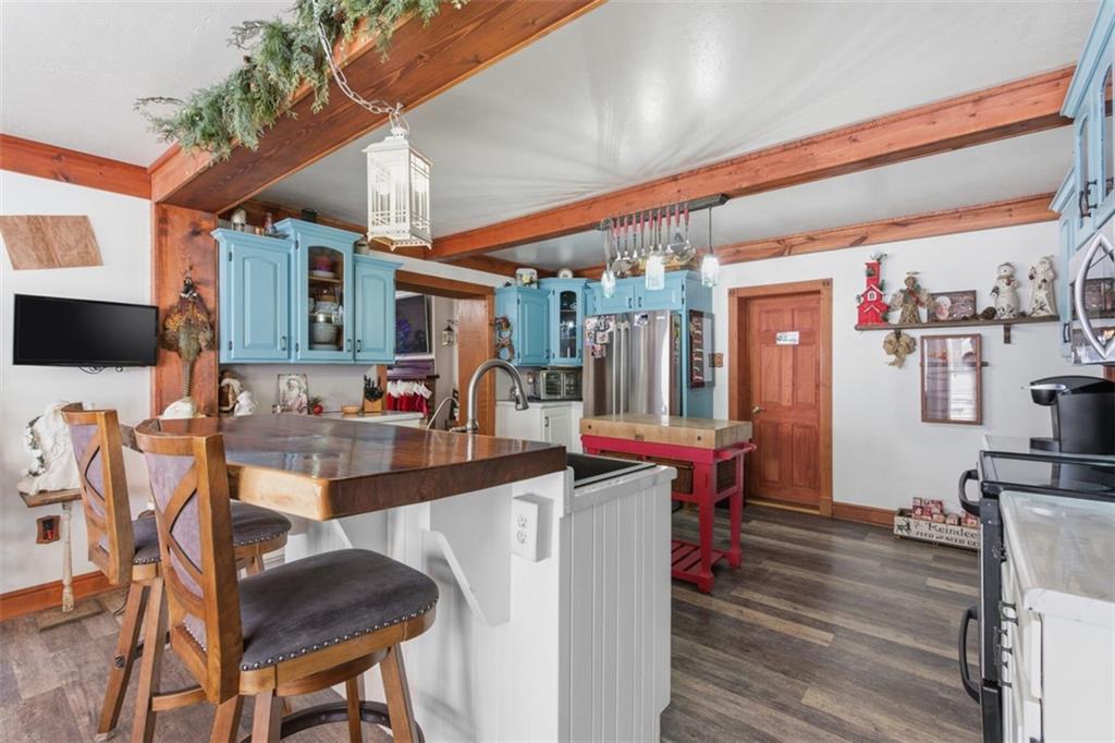2976 Henderson Road Washington, PA 15301 - Photo 12 of 50 a room with stainless steel appliances kitchen island granite countertop furniture and a wooden floor