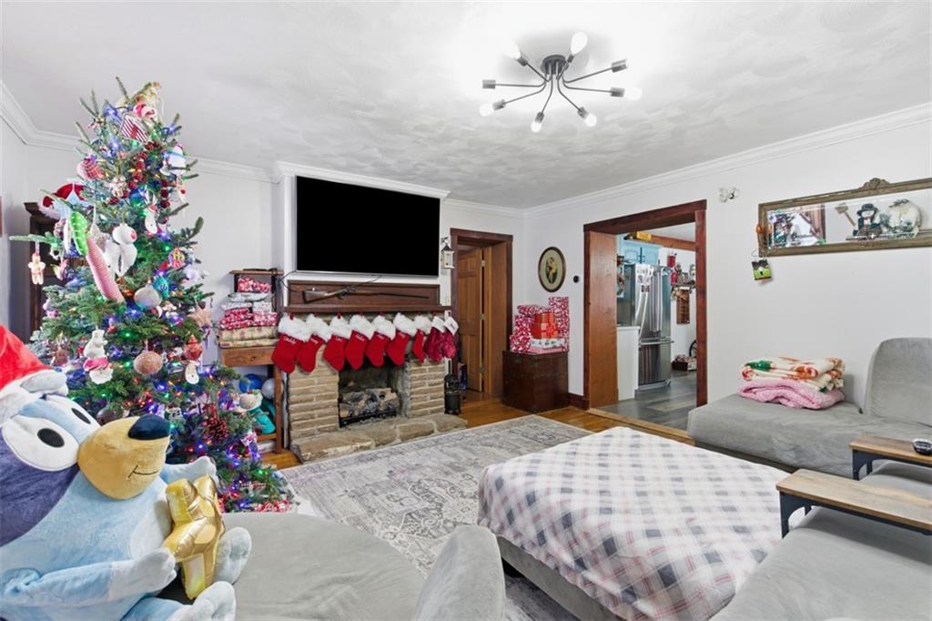 2976 Henderson Road Washington, PA 15301 - Photo 17 of 50 a bedroom with a bed potted plant on the table and a flat screen tv