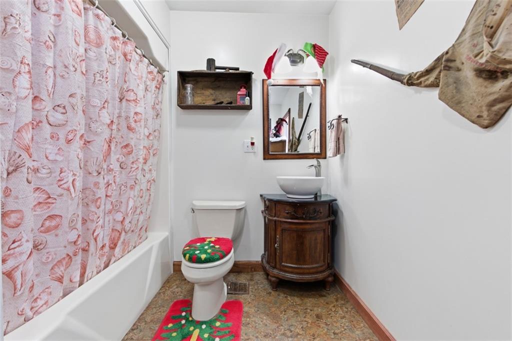 2976 Henderson Road Washington, PA 15301 - Photo 18 of 50 a bathroom with a toilet sink and mirror