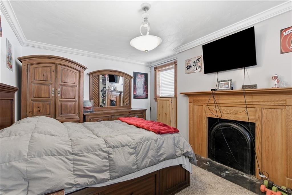 2976 Henderson Road Washington, PA 15301 - Photo 19 of 50 a spacious bedroom with a bed and a flat screen tv